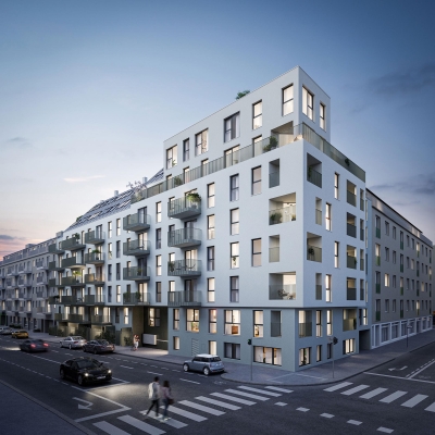Grauer Wohnblock an einer Kreuzung